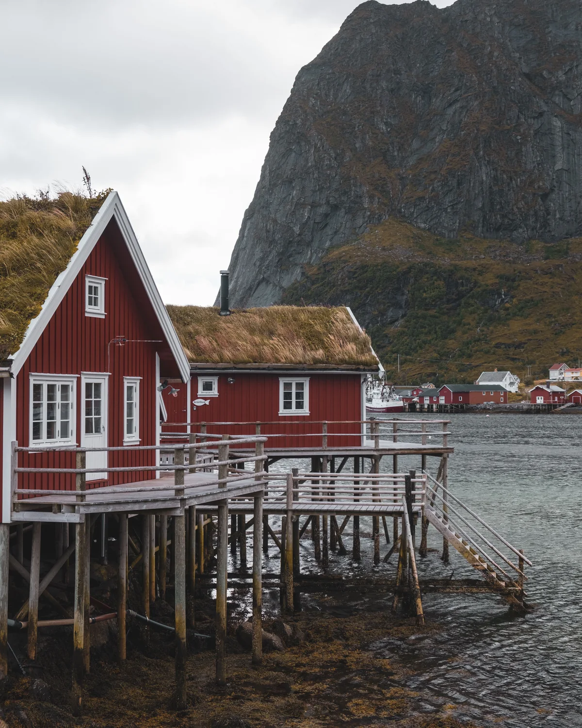 Traditional red cabin beside the sea in Norway